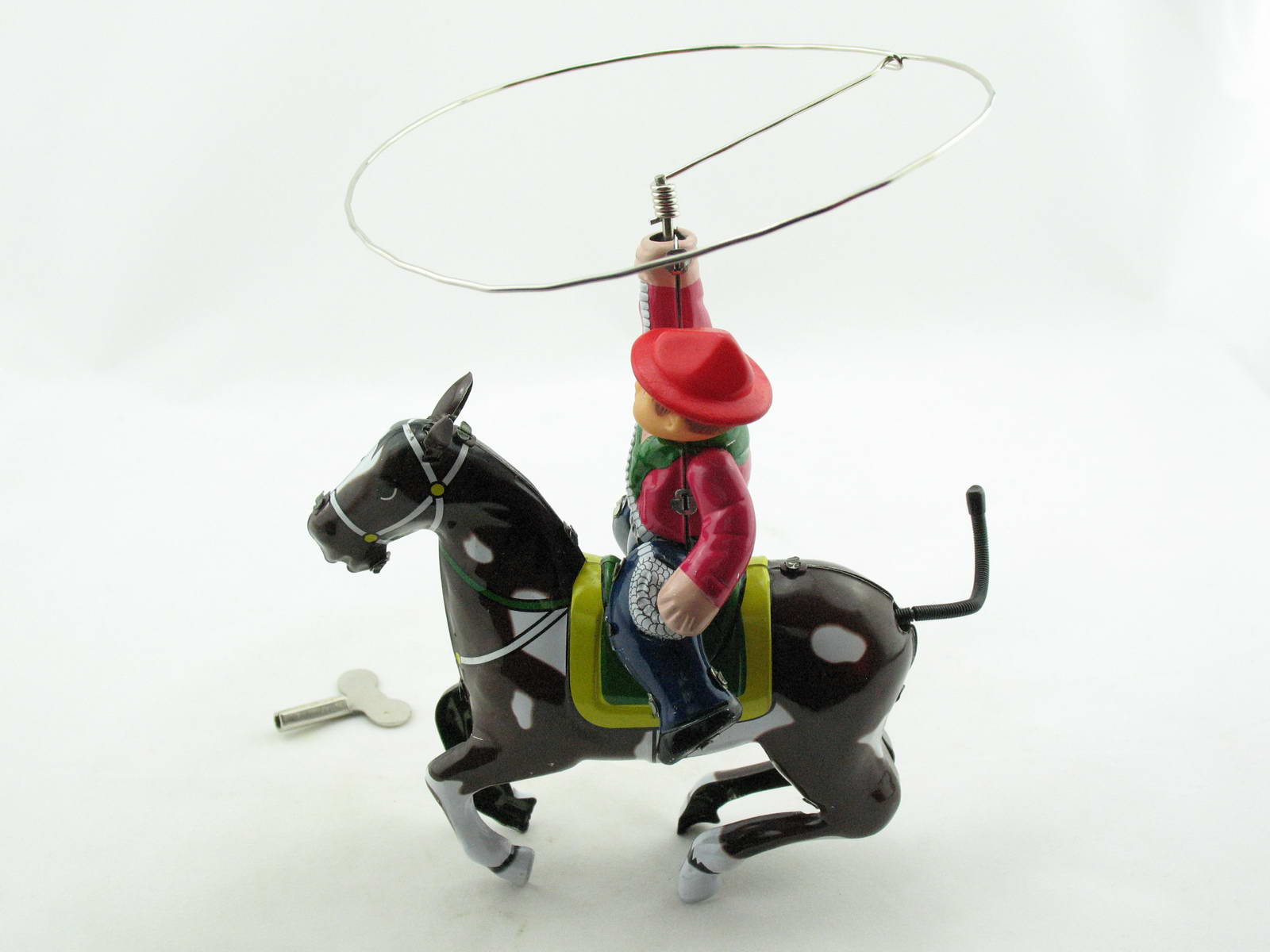 Blechspielzeug - Cowboy auf Pferd mit Lasso