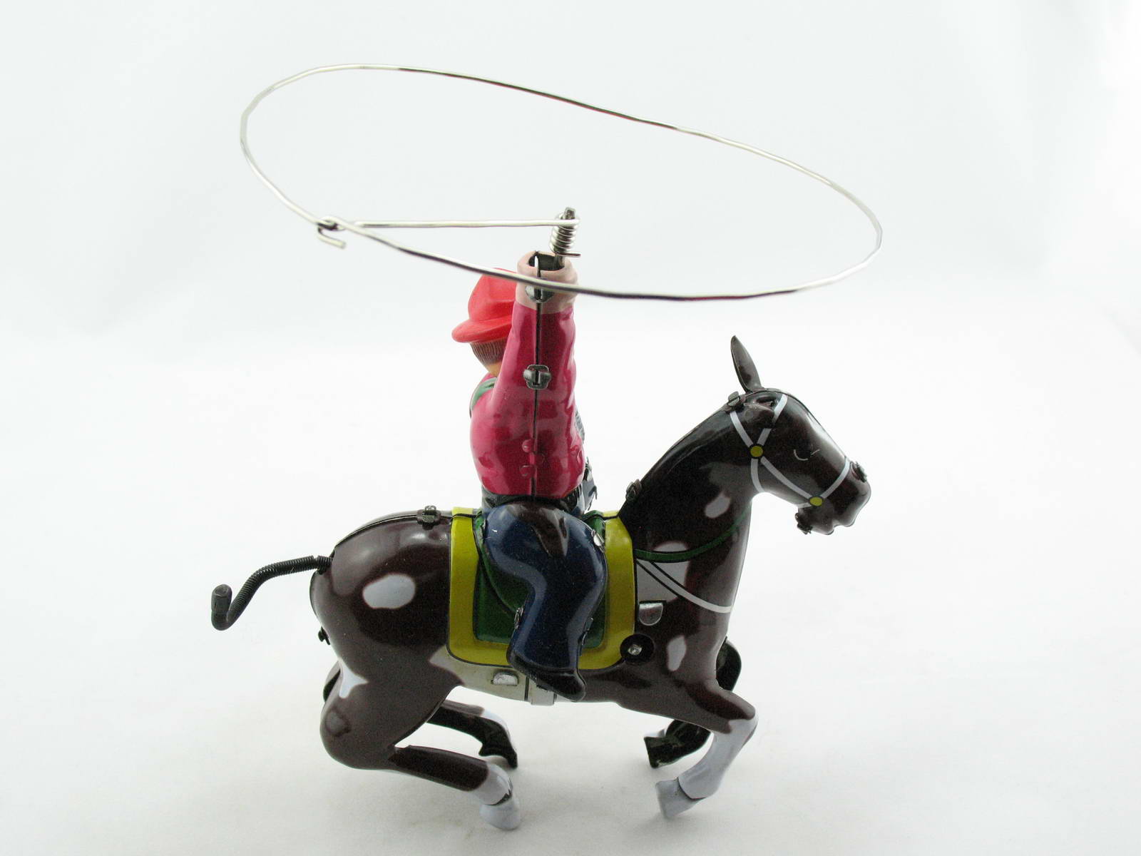 Blechspielzeug - Cowboy auf Pferd mit Lasso